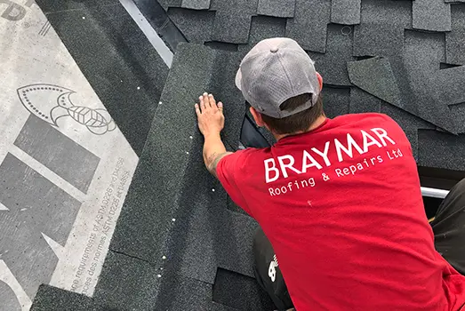 Braymer roofer nailing down shingles thumbnail for article